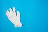 close-up of surgical glove on blue background