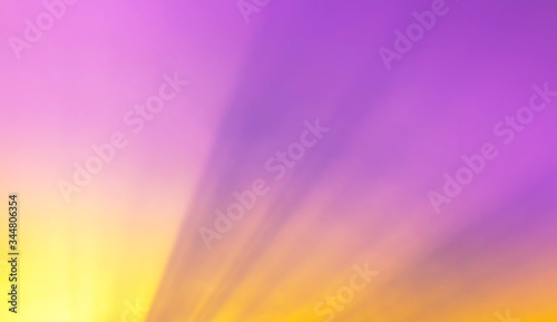 orange sun beam light in purple sky background