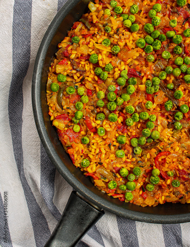 Vegan Paella with red peppers and green beans. 