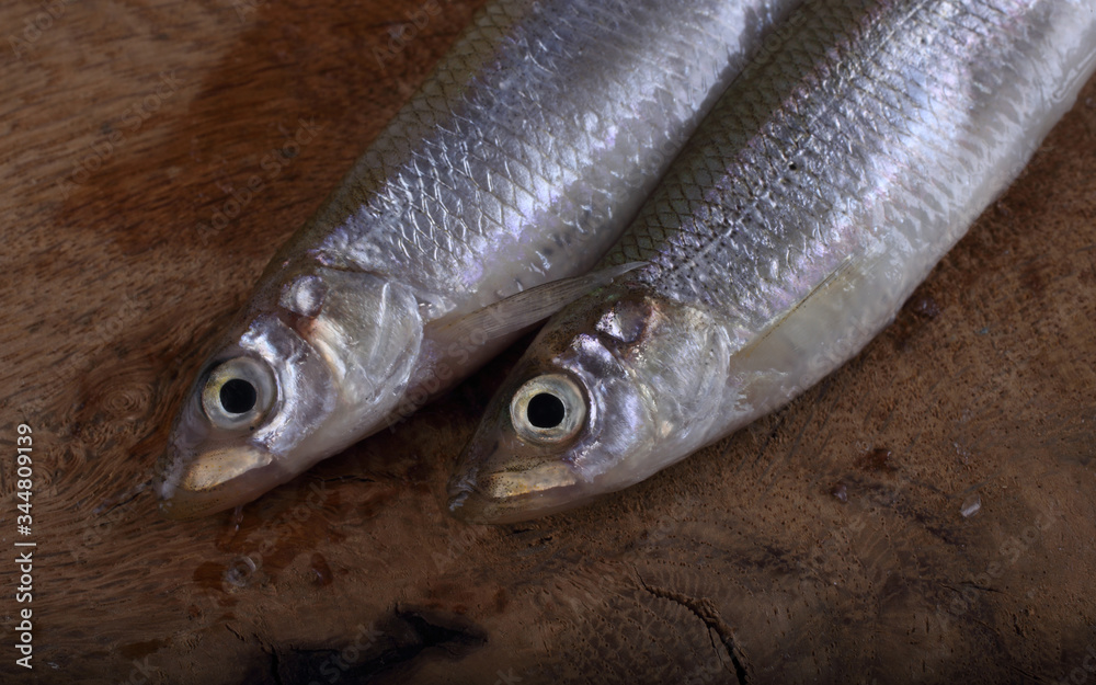 Obraz premium Smelt fish on cutting board