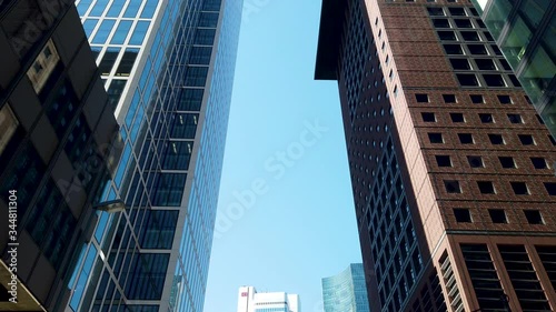 Driving between highrises in Frankfurt financial district photo