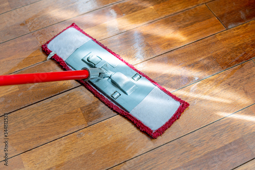 Obraz na plátně A mop washing a wooden floor in an apartment