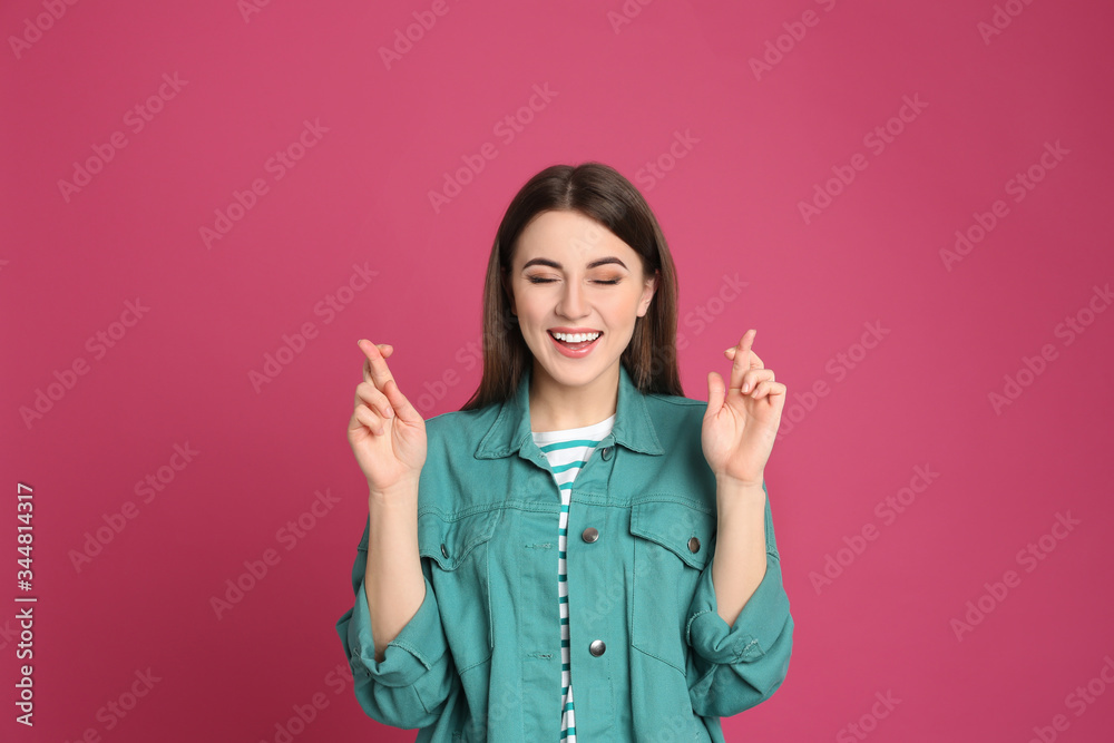 Portrait of happy young woman on pink background Portrait of happy young woman on pink background