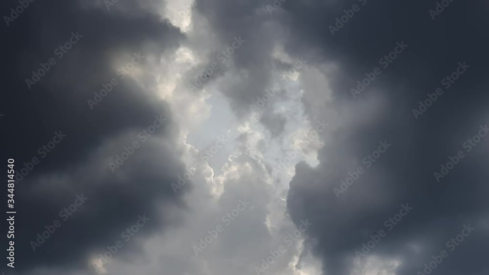 storm clouds in front of sunseting. storm clouds in front of sunseting.