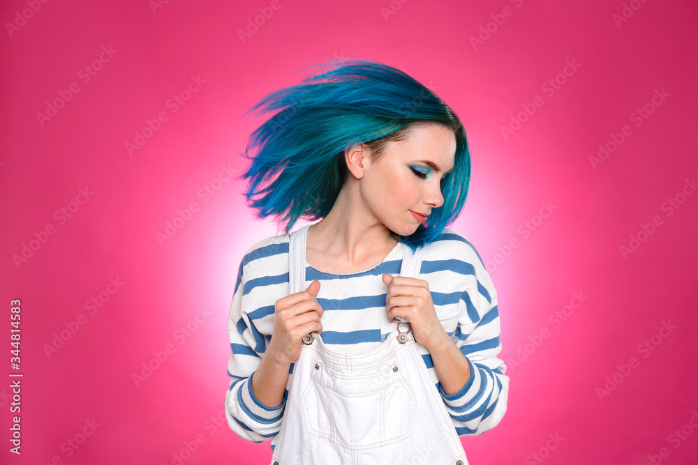 Young woman with bright dyed hair on pink background Young woman with bright dyed hair on pink background