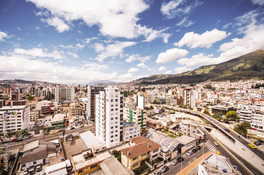 Fototapeta premium Beautiful view from modern part of Quito mixing new architecture with charming streets and green sourroundings, north part of the city of Quito
