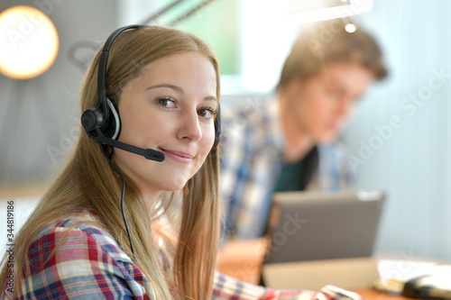 Young woman studying from home during confinement period