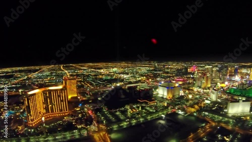 illuminated Las Vegas skyline by night. Scenic flight over 5-star resorts and casinos of Las Vegas strip street. Nevada, United States of America.