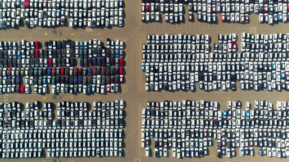 Many cars largest huge parking in seaport port. Automaker car automotive industry. Development manufacturing marketing selling of motor vehicles. Logistics transit. Petersburg Europe. Flight top down Many cars largest huge parking in seaport port. Automaker car automotive industry. Development manufacturing marketing selling of motor vehicles. Logistics transit. Petersburg Europe. Flight top down