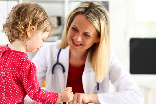 Little child with mother at pediatrician reception. Physical exam  cute infant portrait  baby aid  healthy lifestyle  ward round  child sickness  clinic test  high quality and trust concept