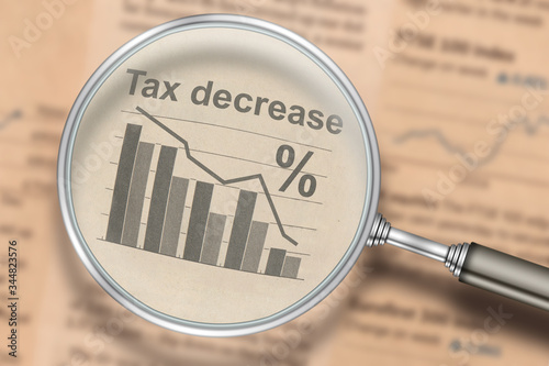 Wallpaper Mural Tax decrease. Focus on newspaper news, falling graph and chart. Business optimization Torontodigital.ca