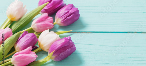Fototapeta Naklejka Na Ścianę i Meble -  spring flowers on blue mint wooden background