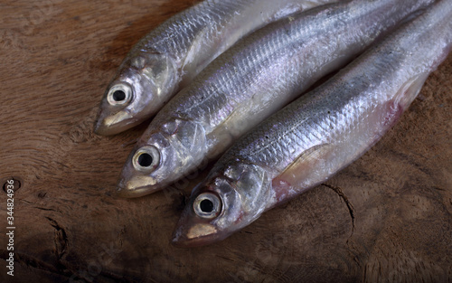 Smelt fish on cutting board