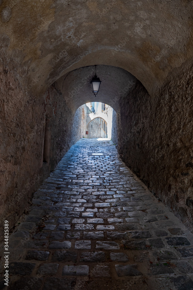 Obraz premium Traunergassl in Duerstein, a Medieval, Old Passageway with Cobblestones in the Wachau Valley, Austria