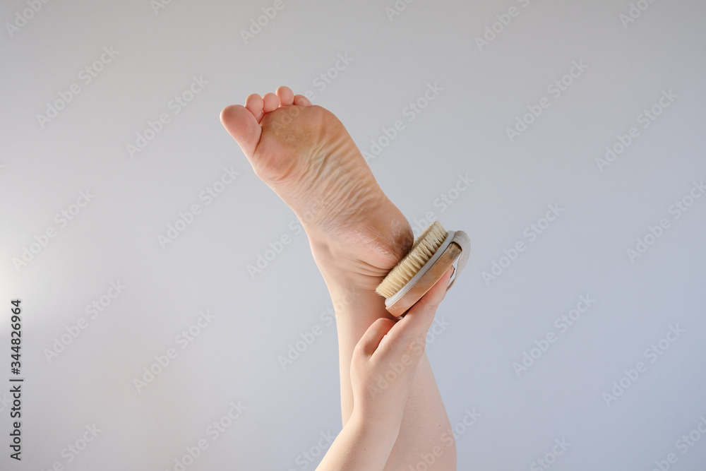 foot with rough skin and a dry heel with many cracks. The concept of