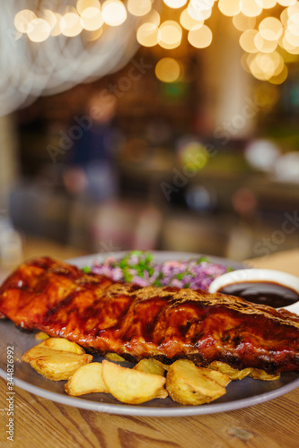 barbeque ribs with potatoes and vegetables