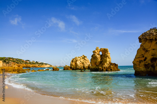 Sunshine above Atlantic rocky coastline Algarve  Portugal. Picturesque seascape with white rocky cliffs  sea bay.Worm Bay along the Great Ocean Road.