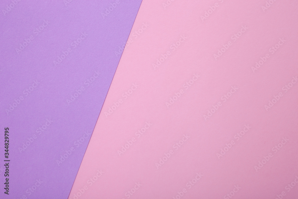 Pink and purple paper as background. Two colored pastel paper texture, top view with place for text Pink and purple paper as background. Two colored pastel paper texture, top view with place for text