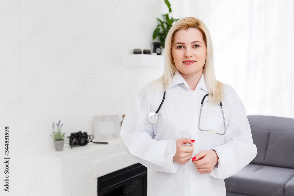 Smiling female doctor in white coat, on white Smiling female doctor in white coat, on white