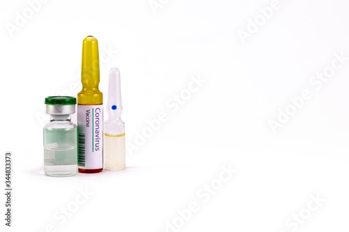 High angle shot of two ampoules and one vial in Corona Virus Vaccine with treatment concept.