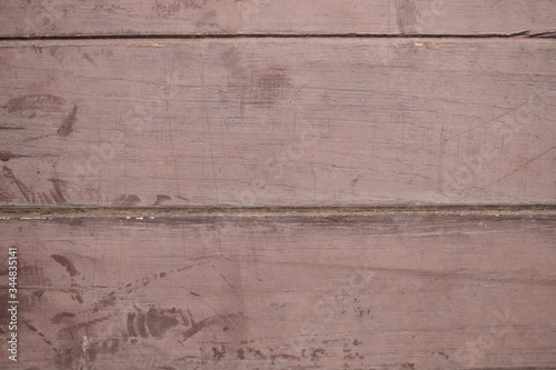 The old plank flooring has been used until it has survived, scratched and cracked.