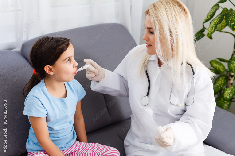 Little girl and young doctor in hospital
