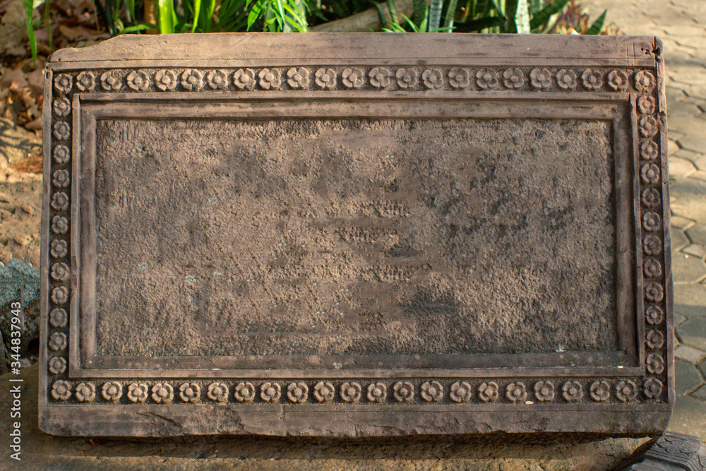 sandstone inscription with flower frame