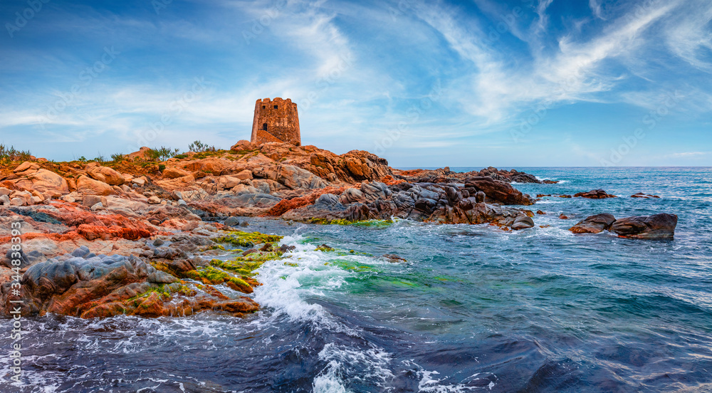 Captivating summer view of Torre di Bari tower. Stormy morning scene of Sardinia island, Italy, Europe. Wonderful seascape of Mediterranean sea. Beauty of nature concept background.