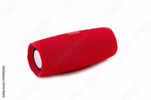 Portable new red wireless speaker, isolated on white.