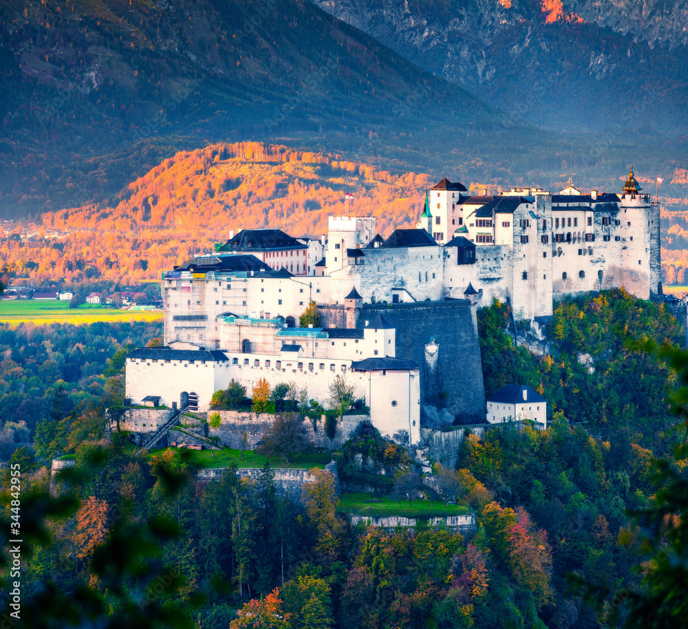 Beautiful morning view of Hohensalzburg Fortress, huge 11th-century fortress complex on a hilltop with views over city to the Alps. Gorgeous autumn cityscape of Zalsburg, Austria. 