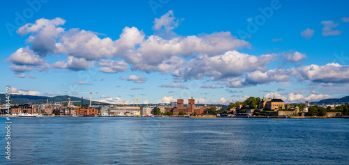 Oslo, Norway - Panoramic view of Oslo waterfront with Akershus Fortress, City Hall and Aker Brygge borough at Pipervika harbor