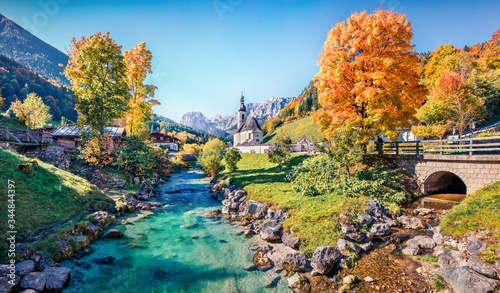 Vivid morning scene of Parish Church of St. Sebastian. Colorful autumn view of Bavarian Alps, Au village location. Bright outdoor scene of Germany countryside, Europe. Traveling concept background..