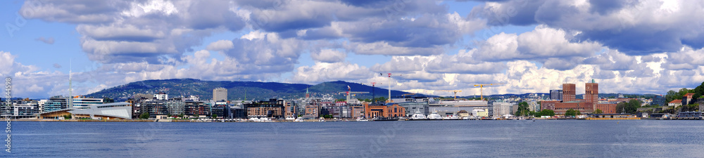 Oslo, Norway - Panoramic view of Oslo waterfront with City Hall, Aker Brygge and Tjuvholmen borough at Pipervika harbor