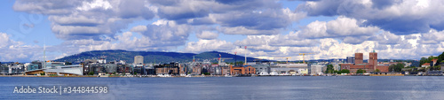 Oslo, Norway - Panoramic view of Oslo waterfront with City Hall, Aker Brygge and Tjuvholmen borough at Pipervika harbor © Art Media Factory