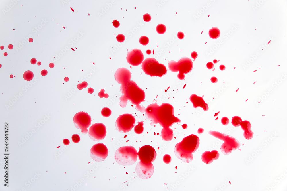 Many drops of blood on a white background
