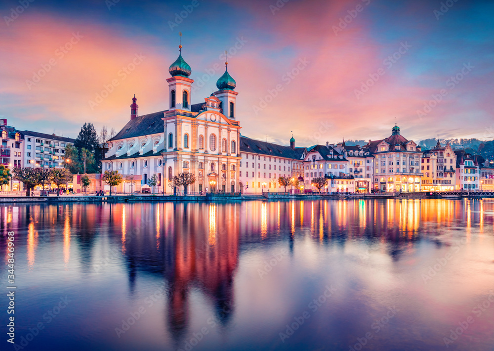 Incredible evening view of Jesuitenkirche Church. Spectacular autumn cityscape of Lucerne. Stunning outdoor view of Switzerland, Europe. Traveling concept background..