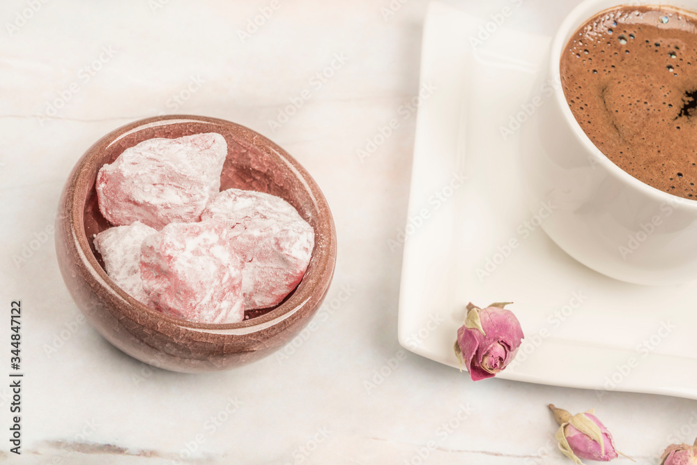 turkish delights and coffee on table with roses turkish delights and coffee on table with roses