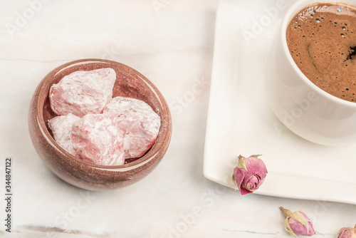 turkish delights and coffee on table with roses