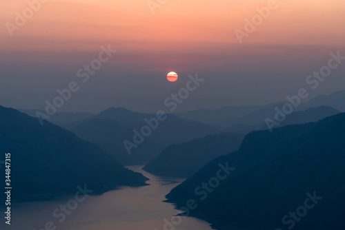 Landscape view of beautiful sunrise on big river and mountain view point