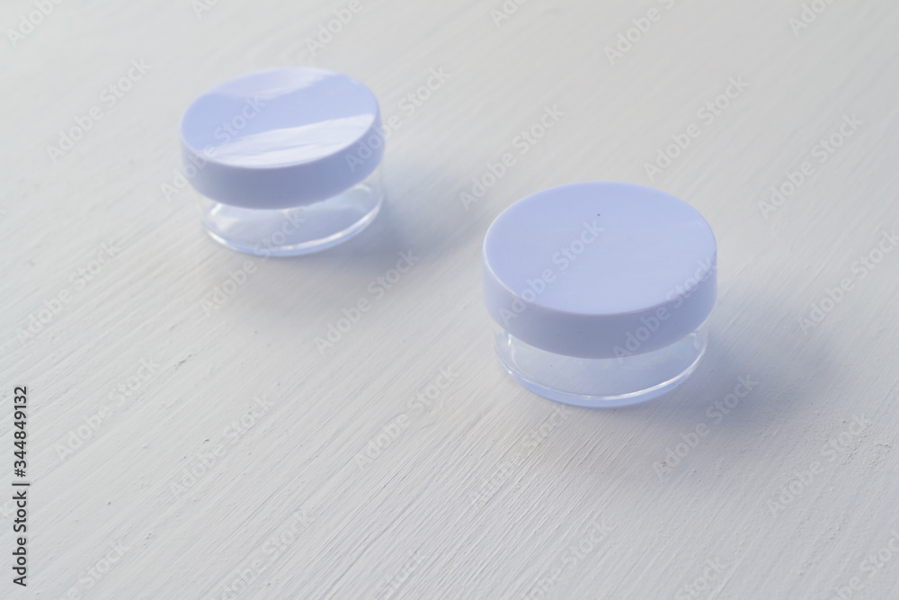 White transparent bottle for soap and cream on a white background. White transparent bottle for soap and cream on a white background.