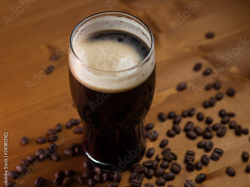 stout or porter with coffee on a wooden pub table