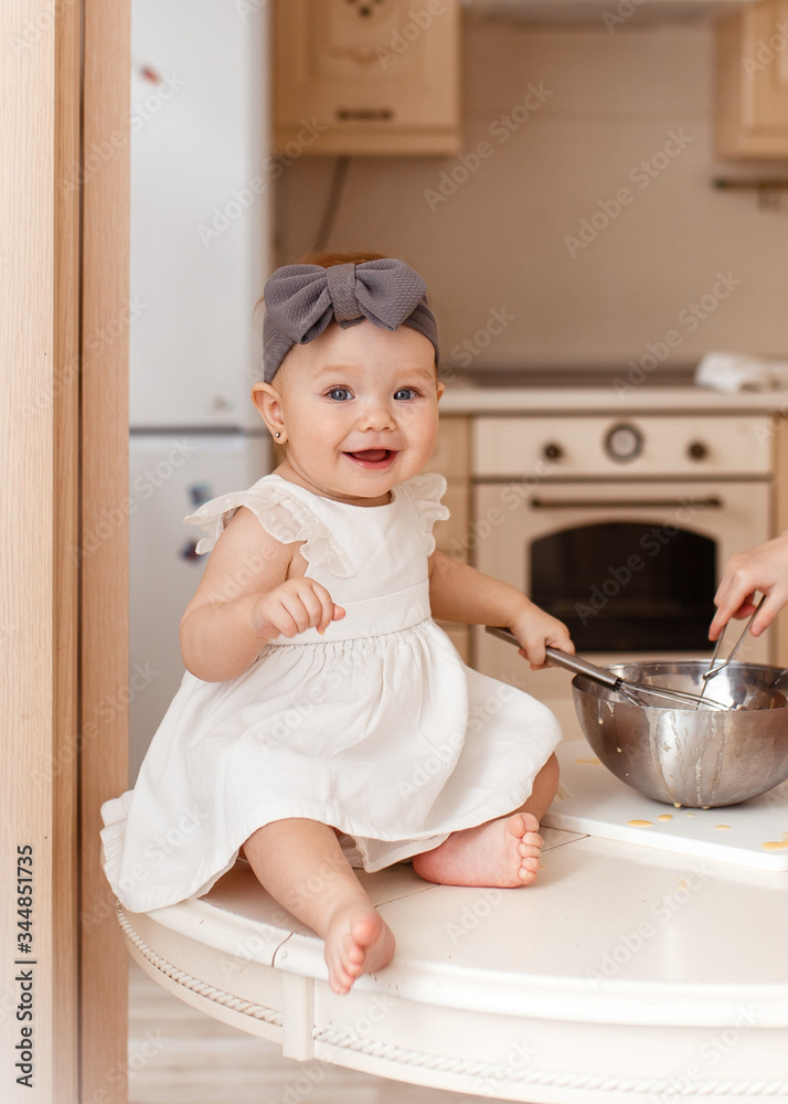 little brother and sister sit on the kitchen table and prepare Breakfast, have fun laugh play in the kitchen at home, baby, boy, girl, family, game little brother and sister sit on the kitchen table and prepare Breakfast, have fun laugh play in the kitchen at home, baby, boy, girl, family, game