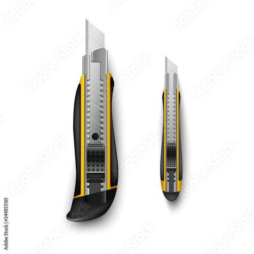 yellow stationery knife big and small isolated on white background

