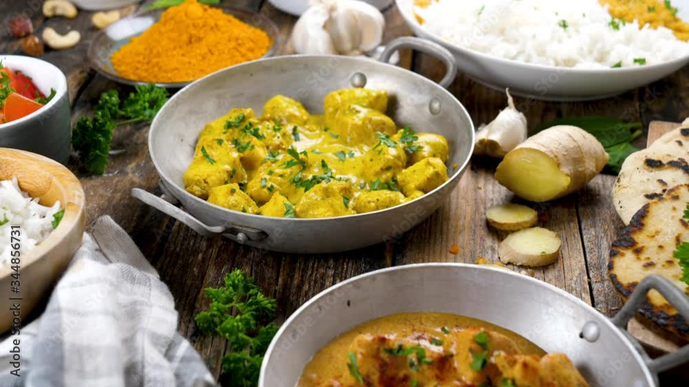 assorted of Indian food with chicken curry cream, rice, spicy ingredient assorted of Indian food with chicken curry cream, rice, spicy ingredient