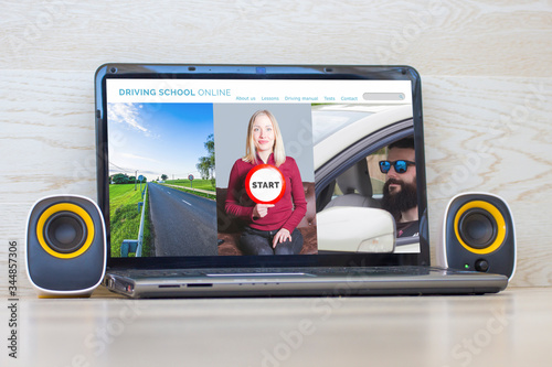 Laptop with driving school online website on the screen