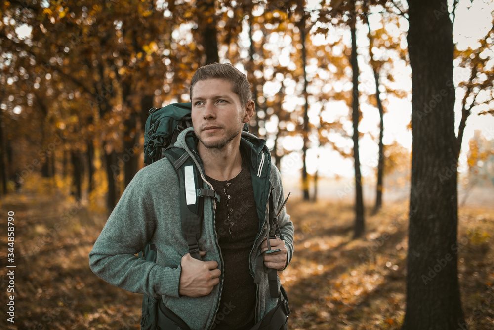 Tourist Walking Along A Forest Footpath In Autumn Tourist Walking Along A Forest Footpath In Autumn