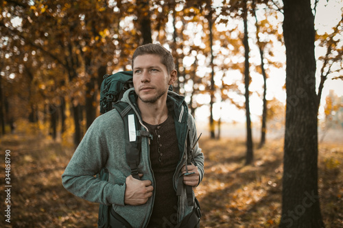 Tourist Walking Along A Forest Footpath In Autumn