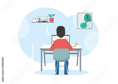 Man is working at the computer. This is a programmer or student or freelancer. Or a person works from a home office or telework