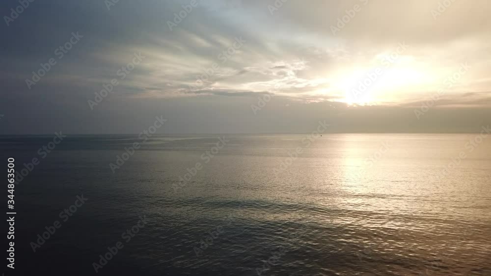 Shot of a beautiful summer sunset at the beach. Sunset at sea drone footage, drone footage 4k Shot of a beautiful summer sunset at the beach. Sunset at sea drone footage, drone footage 4k
