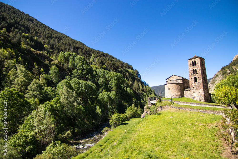 Sant Joan de Caselles (Canillo, Andorra) with beautiful hills surrounding it. Romanesque church build in the 12th century. It is a heritage property registered in the Cultural Heritage of Andorra.